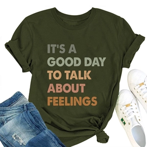 Detail of army green t-shirt with gradient text print and casual outfit styling