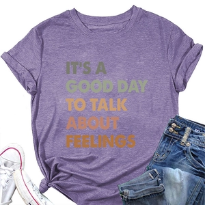 Flat lay of purple cotton T-shirt with It's a Good Day to Talk About Feelings text