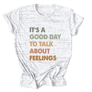 Detail of grey marl cotton t-shirt featuring colorful art text print and ribbed crew neck