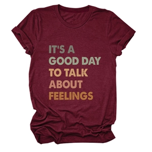 Detail of burgundy cotton T-shirt featuring vintage colorful typography print on the chest