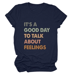 Detail of navy blue cotton T-shirt featuring retro colorful typography slogan print