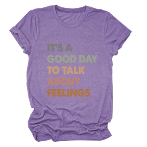 Detail of retro 'IT'S A GOOD DAY TO TALK' slogan print on purple cotton t-shirt