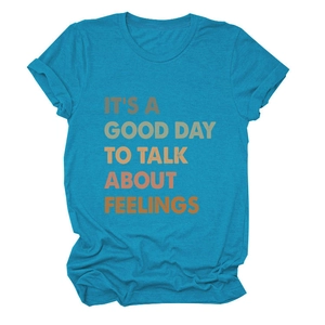 Detail of teal cotton t-shirt with retro 'It's a good day to talk' printed lettering