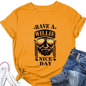 Detail of Willie Nelson print on mustard yellow cotton t-shirt with rolled sleeves