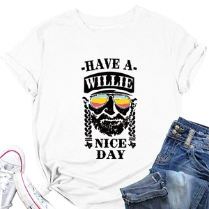 Close-up of Willie Nelson graphic print on white short sleeve T-shirt with flat lay jeans