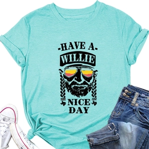 Detail of mint green Willie Nelson t-shirt with portrait print and denim jeans pairing