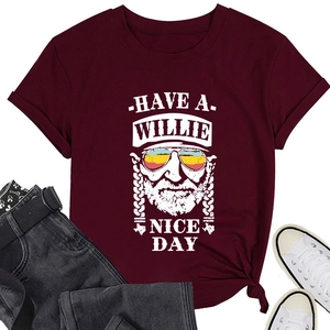 Detail of burgundy T-shirt with 'HAVE A WILLIE NICE DAY' print and portrait graphic
