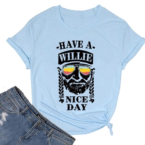 Flat lay of light blue Willie Nice Day graphic tee with stylish portrait and denim shorts