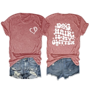Flat lay of dog hair is my glitter t-shirt back design and distressed denim shorts