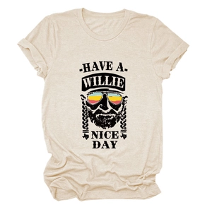 Detail of Willie Nelson portrait print on beige cotton t-shirt with stylized text logo