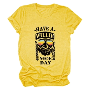 Macro detail of Willie Nelson graphic and text print on yellow heather cotton t-shirt