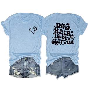 Flat lay of Dog Hair Is My Glitter light blue t-shirt and distressed denim shorts