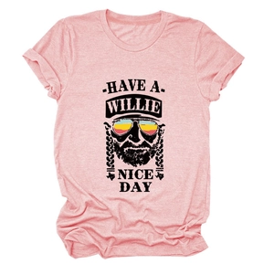 Detailed view of pink T-shirt featuring a Willie graphic print and dual tone texture