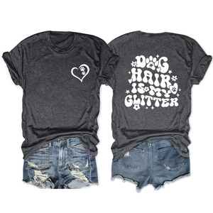 Detail of gray T-shirt with dog hair is my glitter print and ripped denim shorts