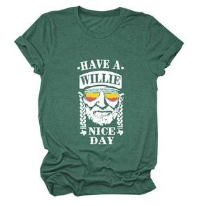 Macro shot of dark green t-shirt with Willie Nelson graphic and Have a Willie Nice Day text