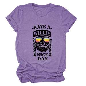 Detail of Willie Nelson graphic print on purple cotton t-shirt with catchy slogan