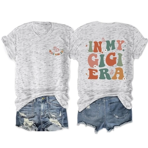 Detail of grey T-shirt with 'In My Gigi Era' text and butterfly print paired with denim shorts