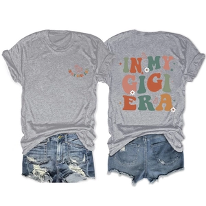 Front and back view of In My Gigi Era grey t-shirt with daisy prints and denim shorts