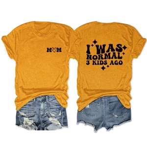 Detail of ginger yellow t-shirt with black M♡M print and I WAS NORMAL 3 KIDS AGO text