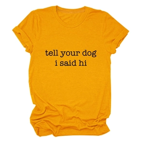 Detailed view of yellow cotton t-shirt featuring tell your dog i said hi text print