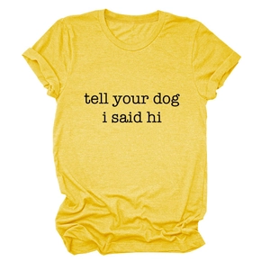 Detail of yellow short-sleeved t-shirt with black Tell Your Dog I Said Hi text slogan
