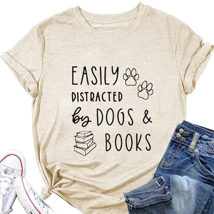 Detail of apricot T-shirt with Easily Distracted by Dogs Books print and casual outfit