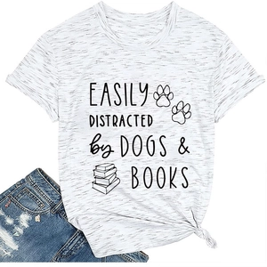 Detail of grey t-shirt showing knot hem design with dogs and books print on white background