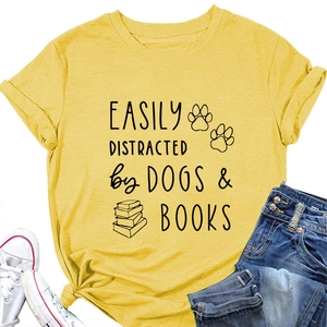 Detail of yellow cotton tee with dog and book graphic slogan and tied hem style