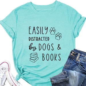 Flat lay of a mint green cotton t-shirt featuring Dogs & Books print with casual jeans