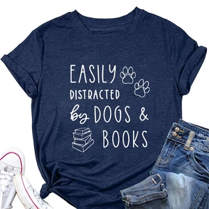 Flat lay of navy blue cotton t-shirt with dogs and books print, jeans and white sneakers