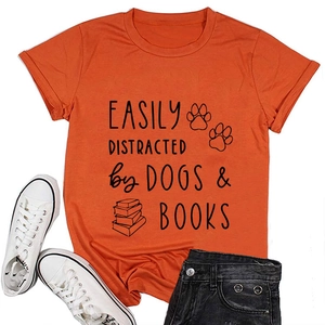 Detail of orange cotton t-shirt with Easily Distracted by Dogs and Books print