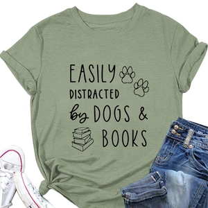 Sage green casual T-shirt detail showing dogs and books print with rolled cuffs