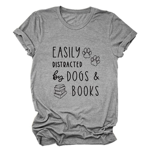 Close-up of grey t-shirt featuring Dogs & Books print with dog paw and book graphic