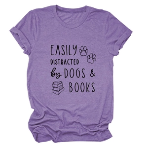 Close-up of the dogs and books slogan print on a purple casual cotton T-shirt
