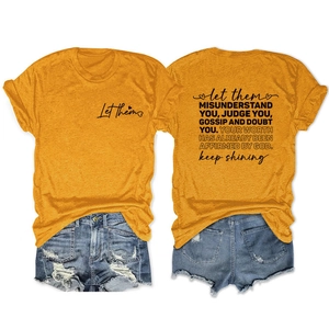 Détails de l'imprimé recto-verso du t-shirt jaune moutarde avec messages inspirants