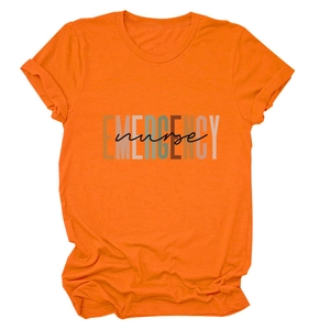 Detail of artistic EMERGENCY nurse lettering print on bright orange cotton t-shirt
