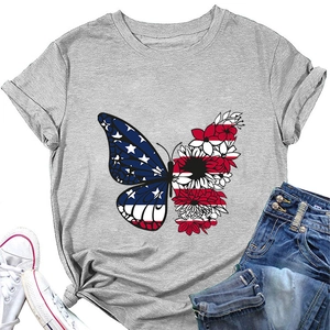 Detail of grey butterfly flag t-shirt paired with denim shorts and white sneakers