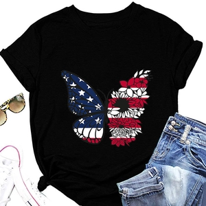 Flat lay of black butterfly t-shirt with American flag pattern, sunglasses and jeans