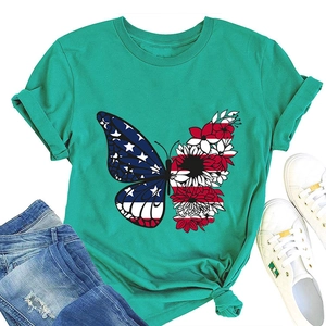 Flat lay of mint green T-shirt featuring creative butterfly print with US flag and floral wing