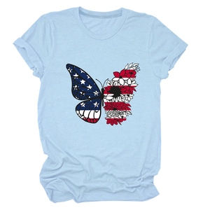 Detail of butterfly print with American flag stars and floral pattern on light blue T-shirt