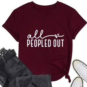 Flat lay of burgundy t-shirt with all PEOPLED OUT slogan and casual denim outfit