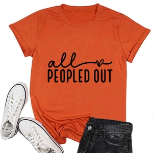 Flat lay of orange crew neck T-shirt with 'all PEOPLED OUT' slogan and heart print