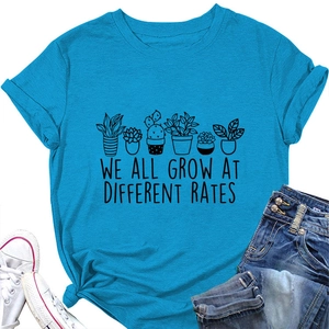 Flat lay of blue cotton t-shirt with plants print and casual denim shorts outfit