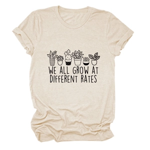 Detail view of cotton T-shirt featuring botanical plant print and inspirational slogan