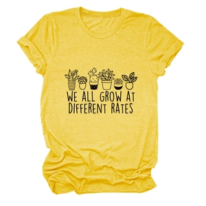 Detail of cotton crew neck tee featuring botanical prints and motivational slogan