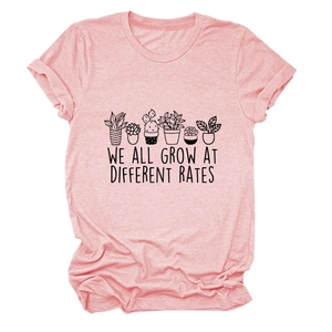 Pink crew neck T-shirt featuring potted plants illustration and we all grow text