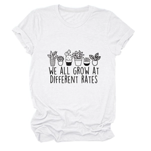 Close-up of succulent plants print and We All Grow At Different Rates text on a white T-shirt