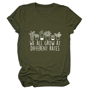 Detailed view of plant print and 'WE ALL GROW AT DIFFERENT RATES' text on olive t-shirt