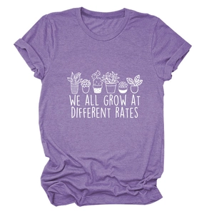 Detail of purple cotton T-shirt featuring a potted plant print and inspirational slogan