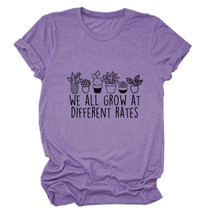 Detail of purple cotton T-shirt featuring potted plants and motivational text print